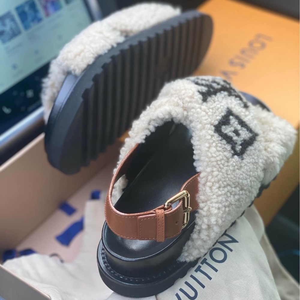 Worn a couple or if times authentic LV furry slides
